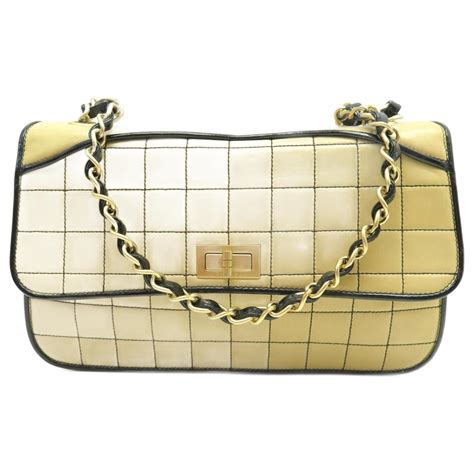 chanel beige stitched purse with locking clasp|chanel flap bag.